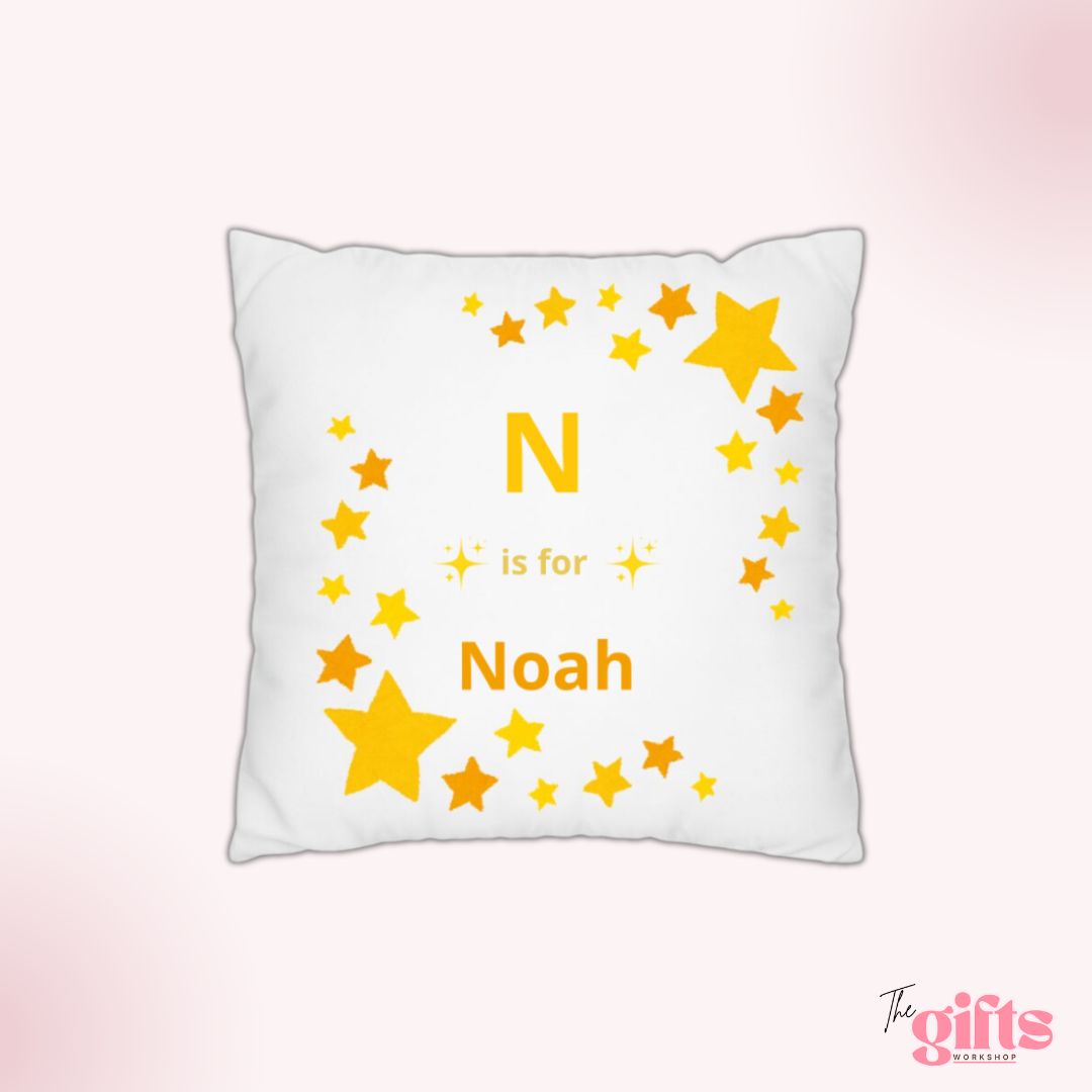 Star-patterned pillow with 'N is for Noah'.