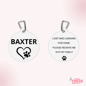 Circular pet tag with 'BAXTER' and 'Lost and Longing for Home' text, from The Gifts Workshop